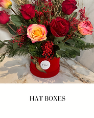 Red Roses with Pine leaves in a velvet red hat box
