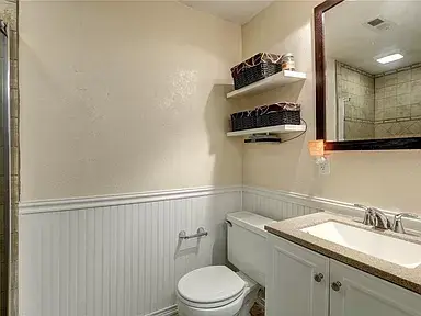 Master shower was redone with wainscoting, new vanity and mirror.