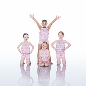 four dancers in pink layered costume