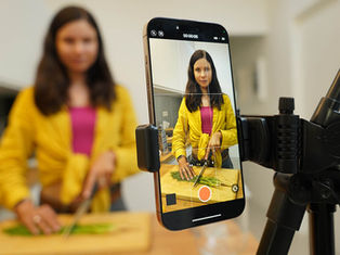female prepping food for a video that she will be using for social media suggested by Willow Graphix for marketing in Midland, Barrie, Simcoe County Ontario