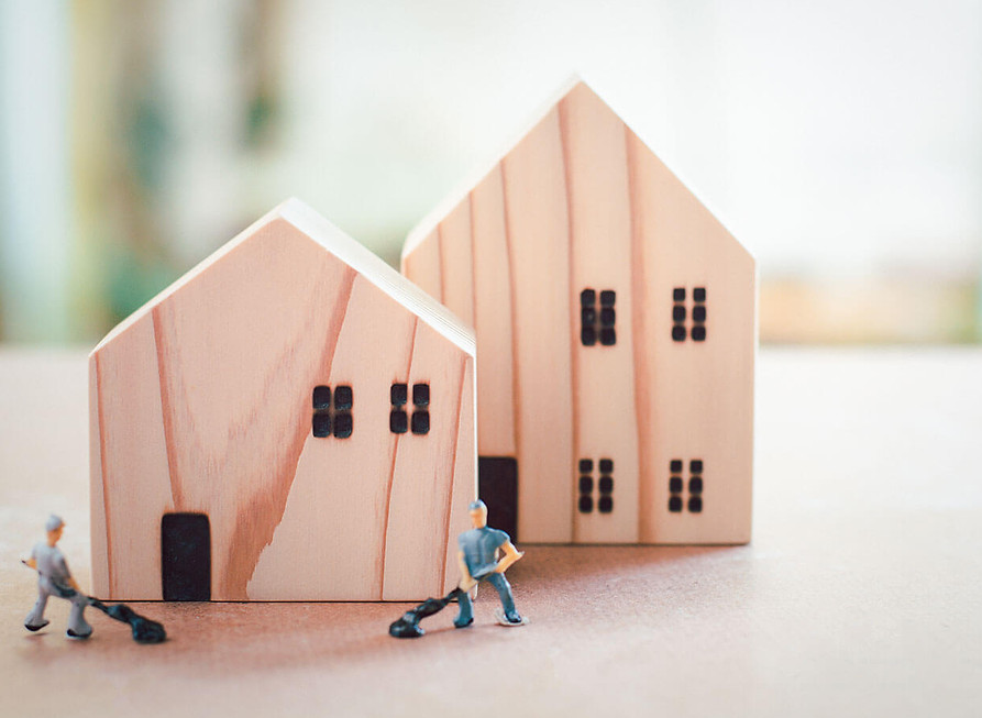 wooden homes with tiny toy maintenance guys