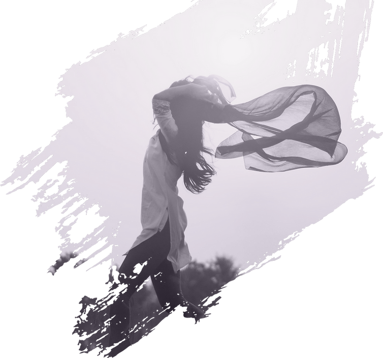 a photo of a young woman on a hillside, holding a large vail that is caught in the wind.