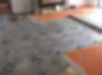 grey floor tiling being set