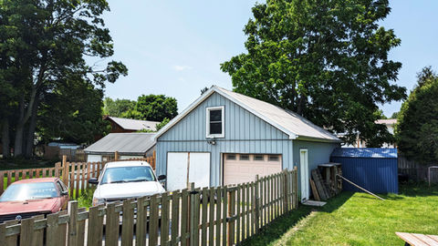 TT Garage Classic & Custom Car Specialists, outside, side view of garage and fence