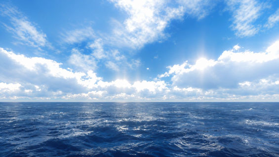 Serene Ocean Horizon Under Radiant Clouds.jpg