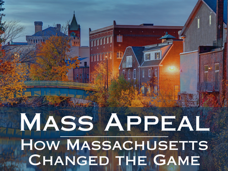 Autumn scene of a Massachusetts town with colorful trees, a bridge, and historic buildings at dusk. Text reads "Mass Appeal: How Massachusetts Changed the Game."