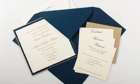 This elegant invitation is engraved on a deckled card in gold ink and layered with gold and navy papers for a classic look. The outside was wrapped  in soft white band to seal the set and finished off with a real aspen leaf, perfect for a Colorado wedding.

