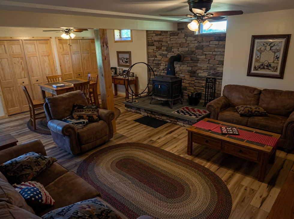 hidden-creek-living-room-woodstove.png