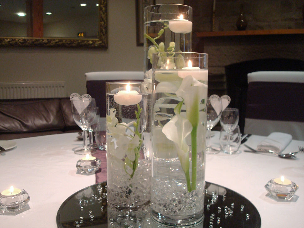 Cylinder style table centrepiece fresh flowers