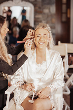 Bride in Makeup chair sw wedding films