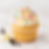 Vanilla cupcake with sprinkles, a tasty treat.