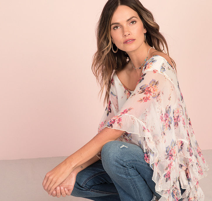 A model poses wearing a bohemian shawl.