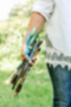 Women with paint brushes on a green background