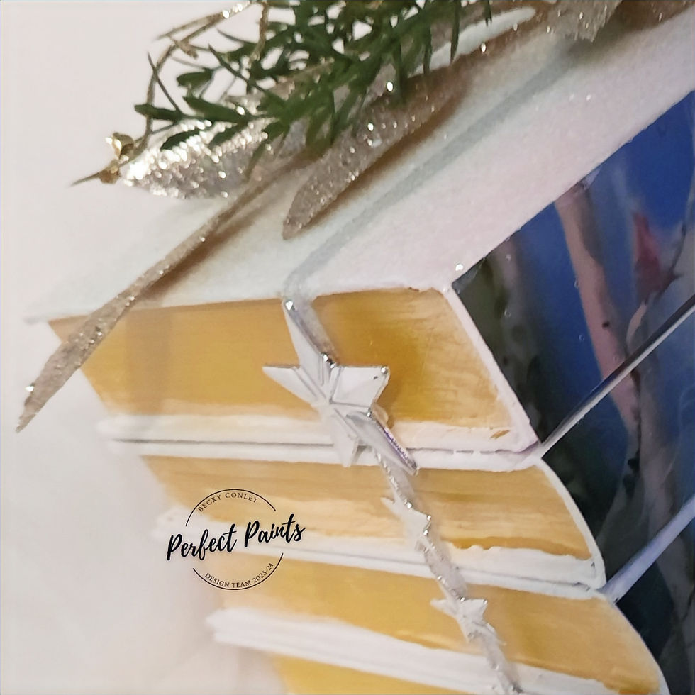 Shimmering stucco added to the book cover along with glitter to mimic snow