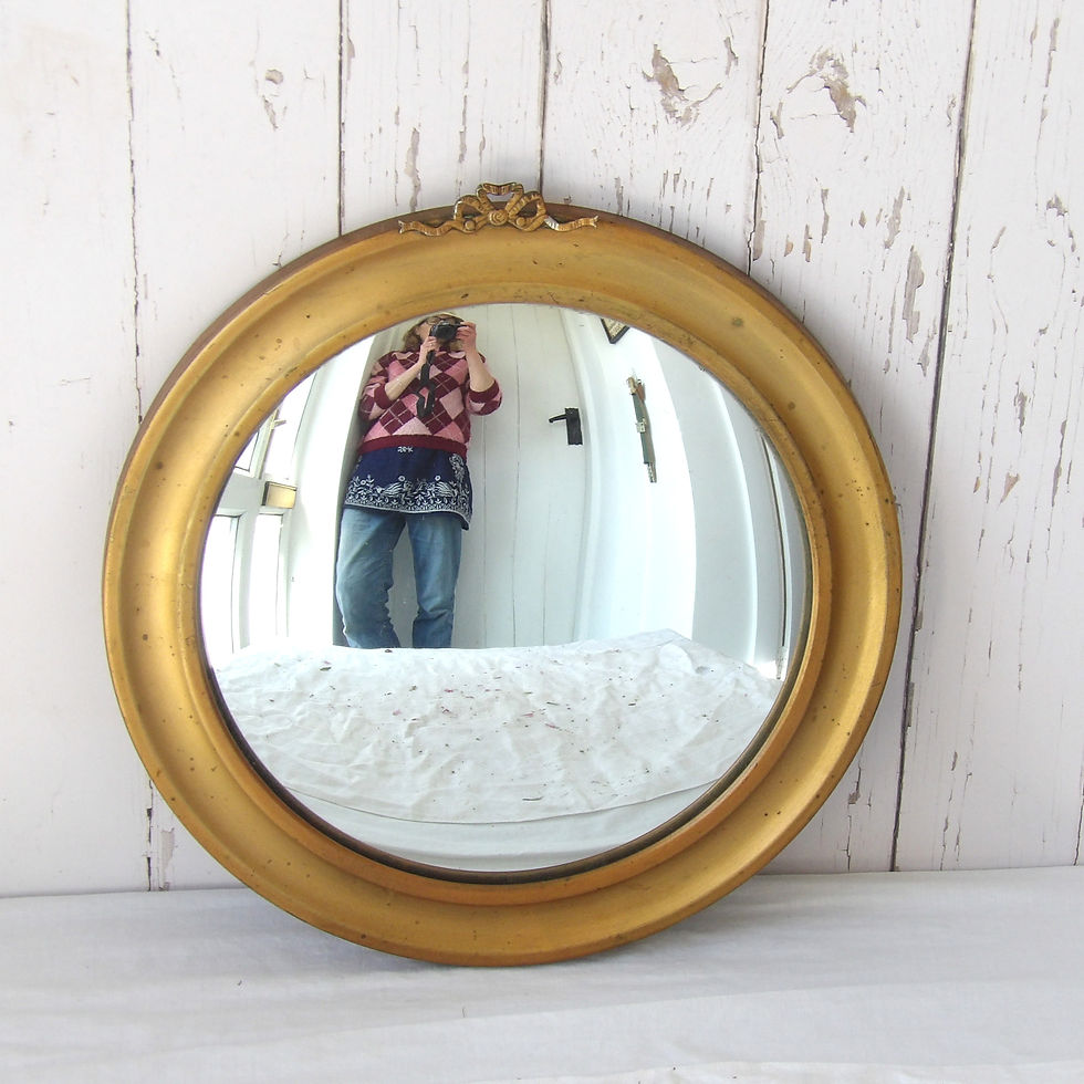 vintage gold metal convex wall mirror with bow motif