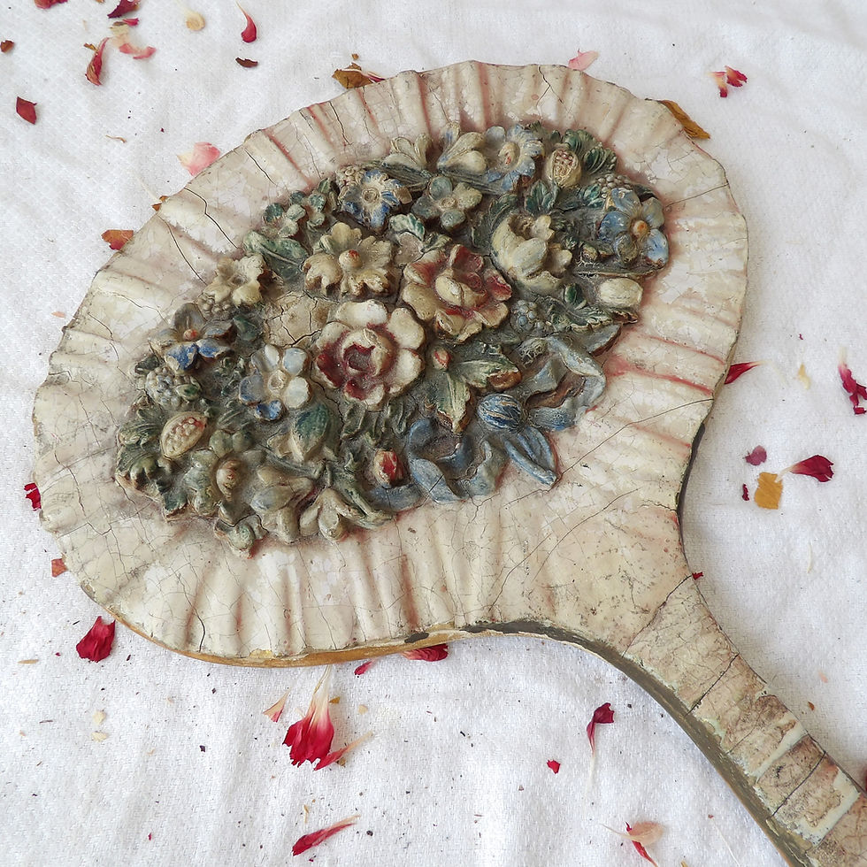 Antique oval barbola hand mirror with ceramic flowers