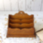 vintage wooden letter rack with printed motifs