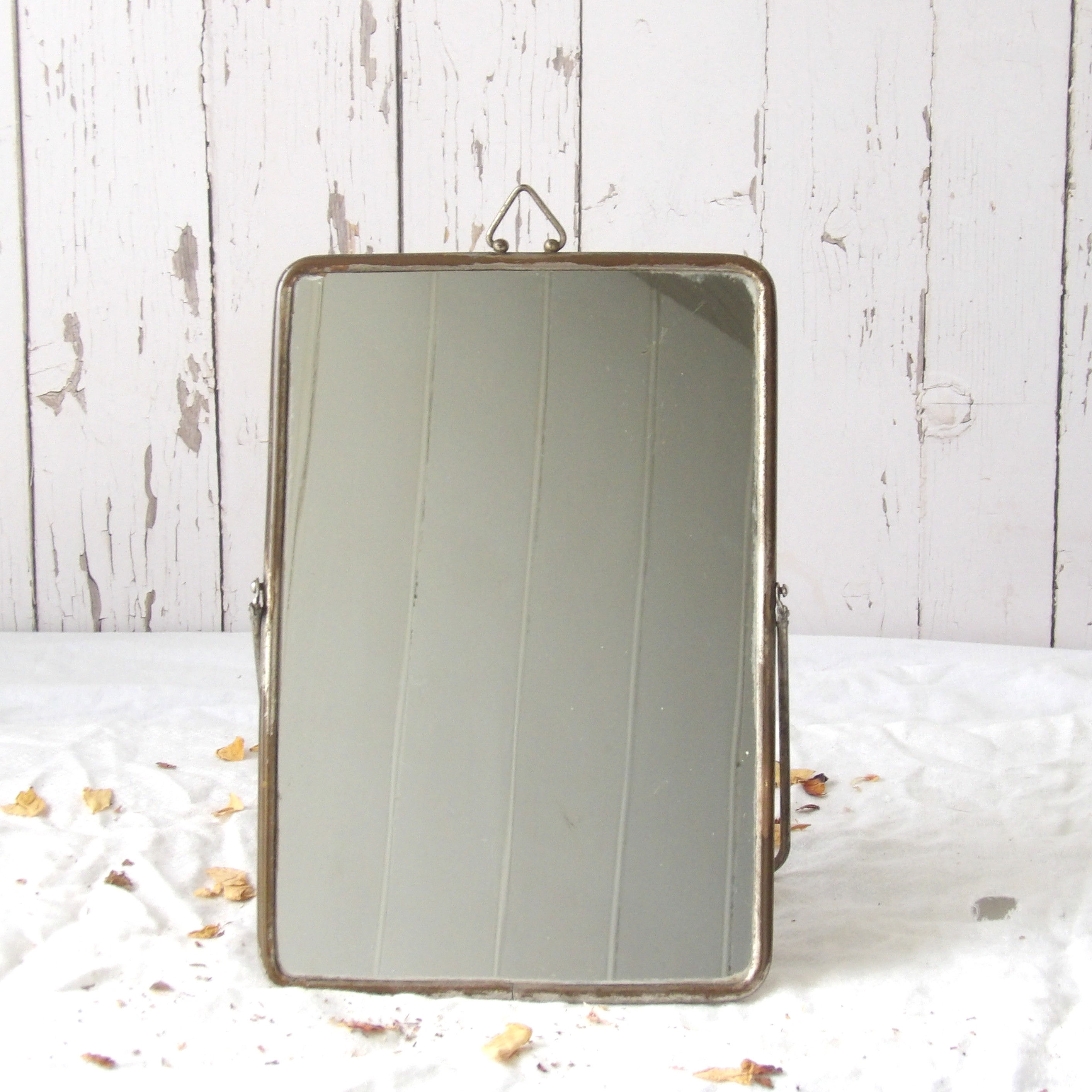 Antique mirror on brass folding stand
