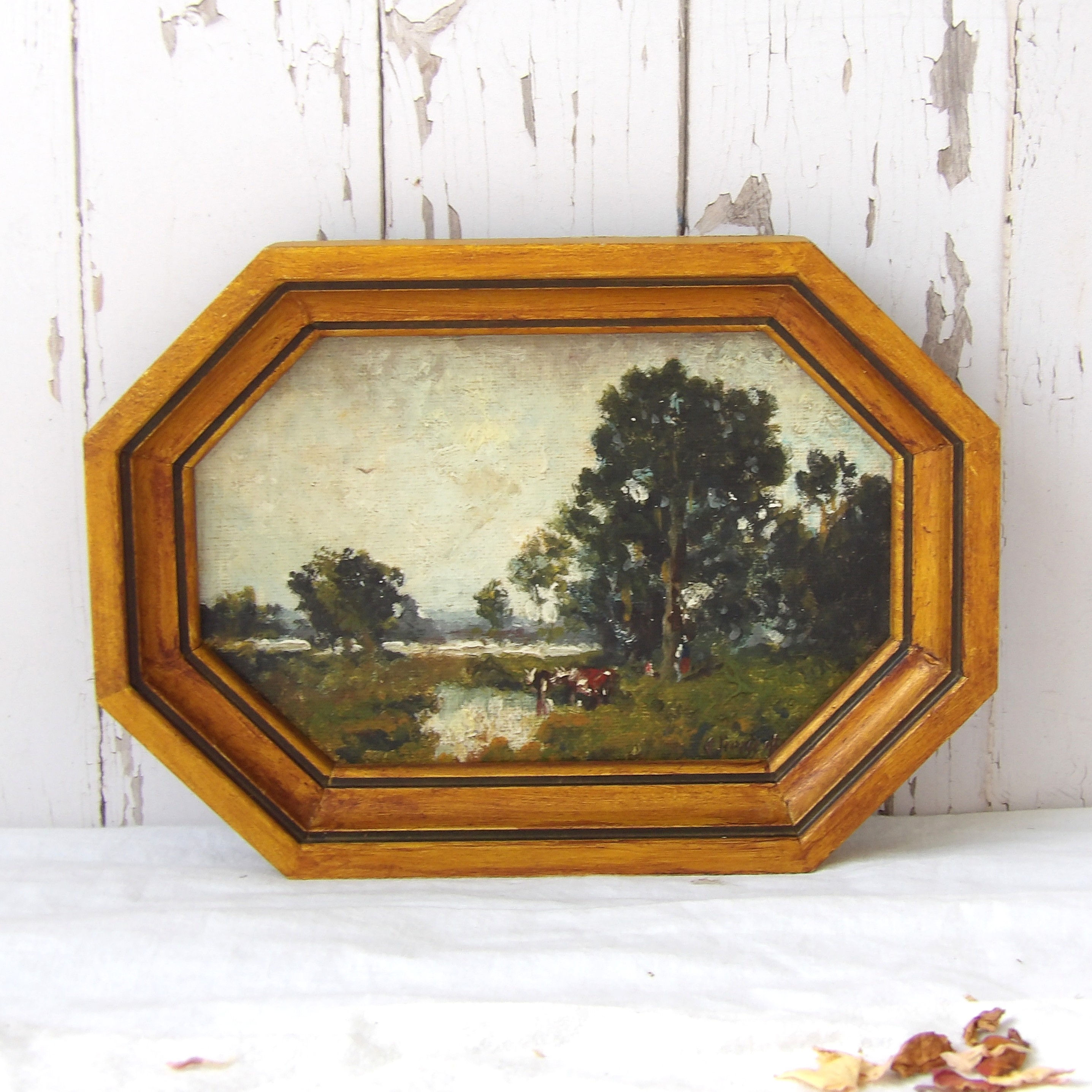 framed vintage countryside painting with cows
