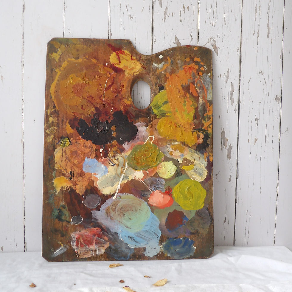 vintage artist palette with colourful paint splashes