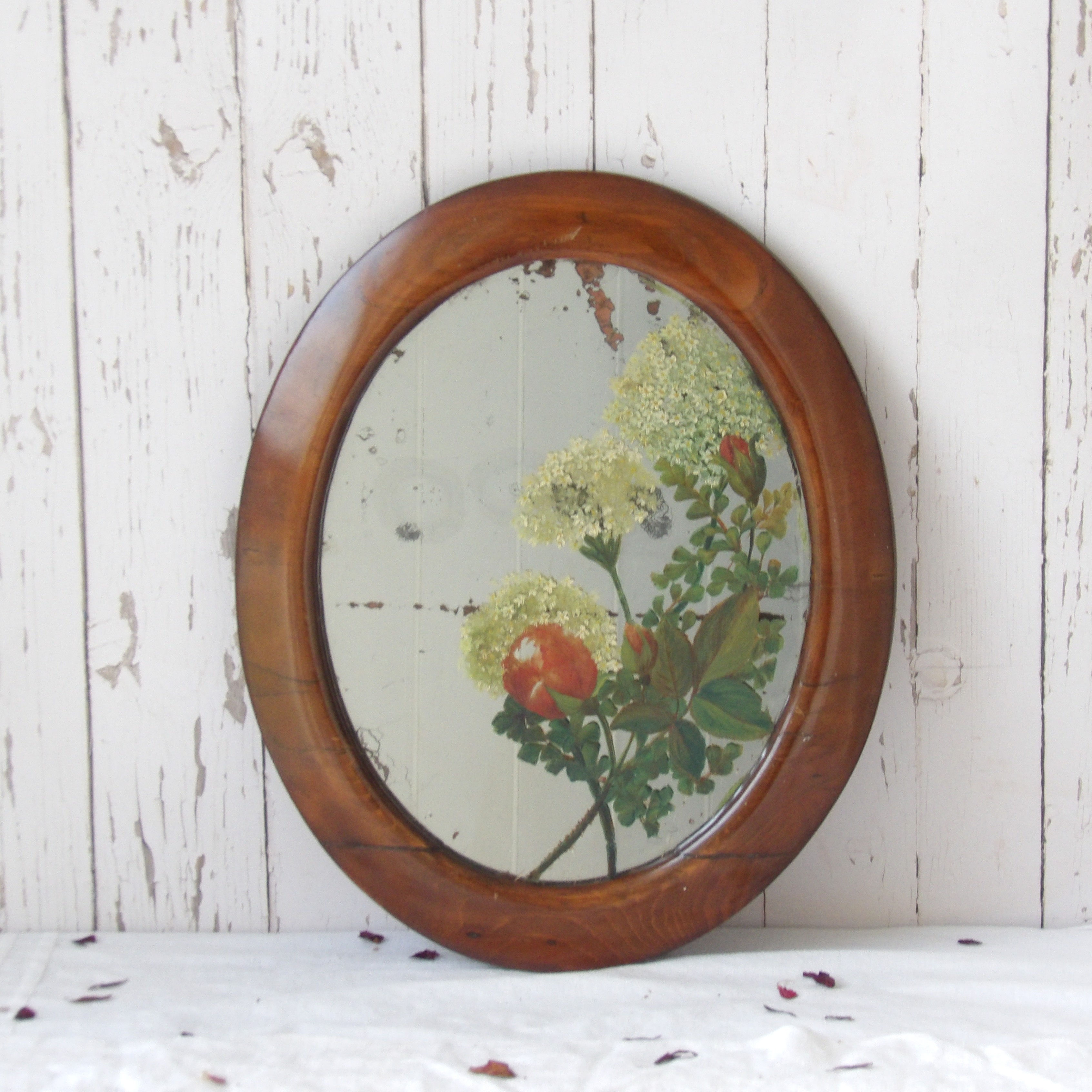 antique oval wooden wall mirror with painted flowers