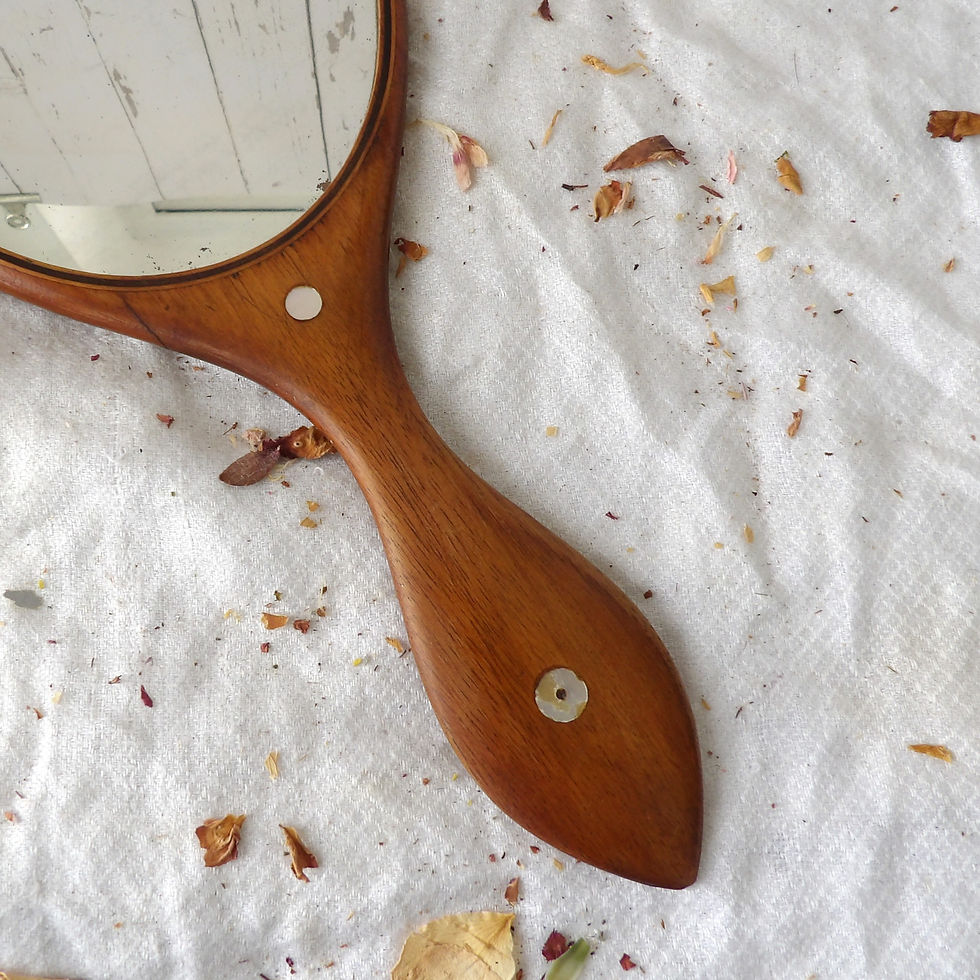 Thumbnail: antique wooden hand mirror with mother of pear discs
