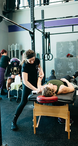 Physical therapist working on a patient's shoulder