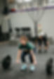 CrossFit athletes lifting barbells