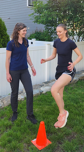 Physical therapist with a patient doing cone taps