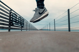 Woman jumping with Nike cross-training shoes