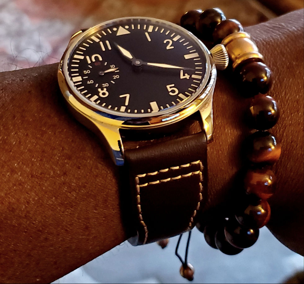 WOTD wrist-shot of the Parnis, Big Pilot Mechanical, With Sterile Dial.  Paired large-gauge, Tiger's Eye stone bracelet.
