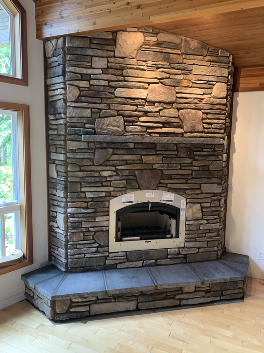 fireplace with custom stone wall

