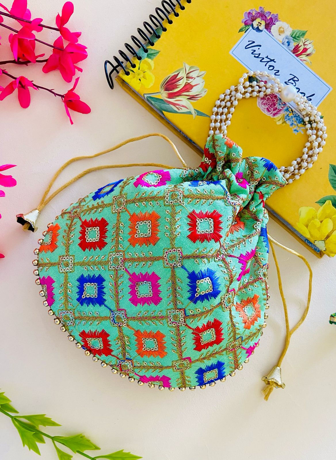 Women Green Embroidered Designer Potli bag with Pearl Handle and latkan