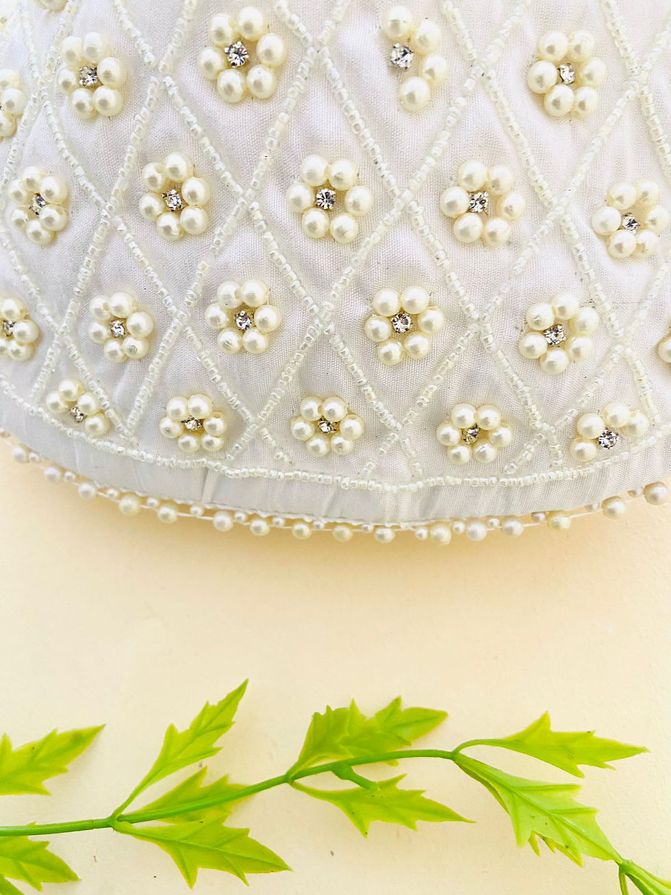 Thumbnail: Women Premium Pearl Hand work White Potli bag with Heavy Pearl handle a