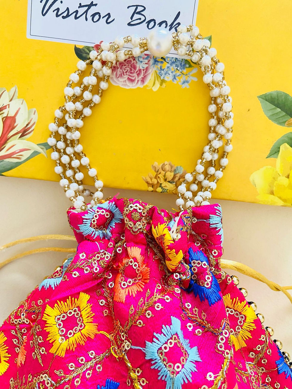 Thumbnail: Women Pink Embroidered Designer Potli bag with Pearl Handle and latkan