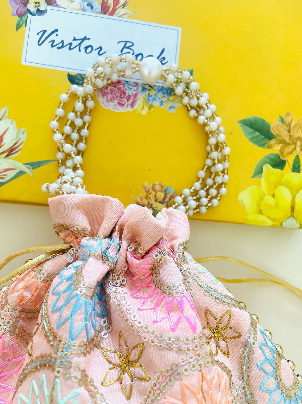 Thumbnail: Women Peach Sunflower Embroidered Wedding Potli Bags with Pearl handle