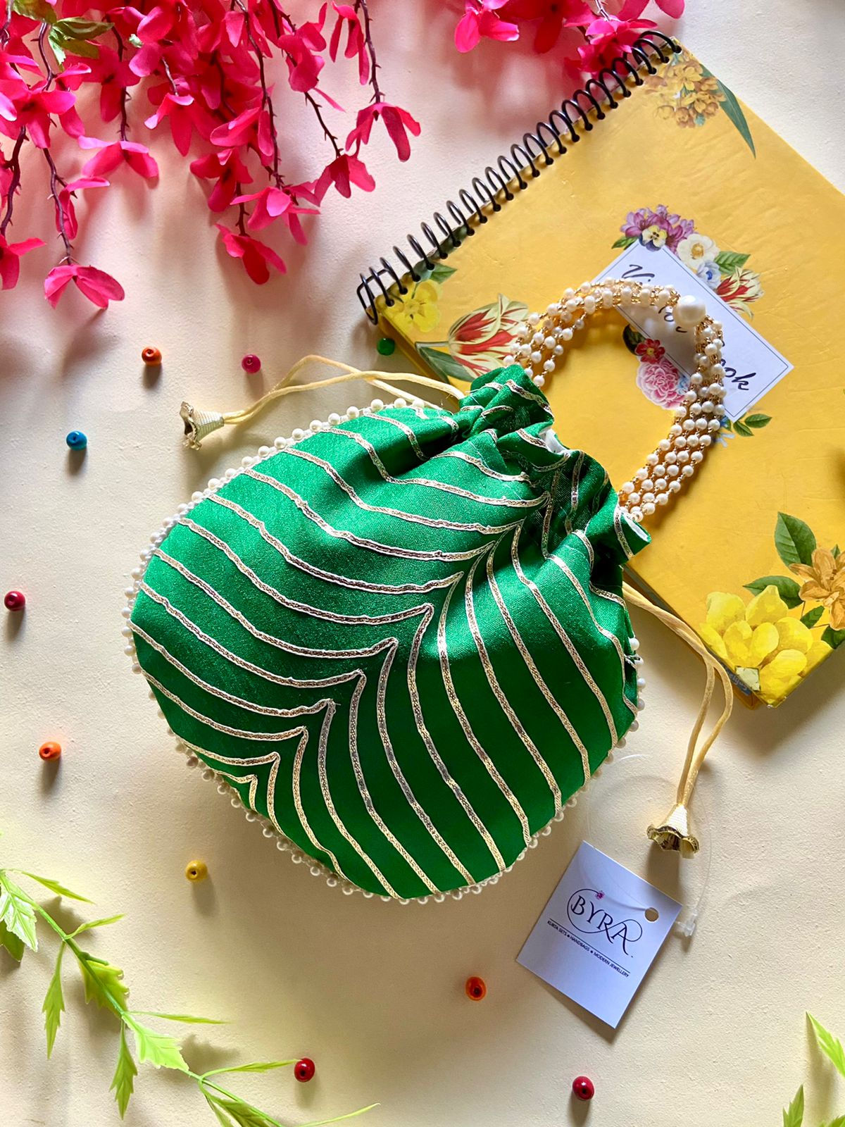 Women Gotta Work Dark Green Potli bag with Pearl handle, Latkan for festi