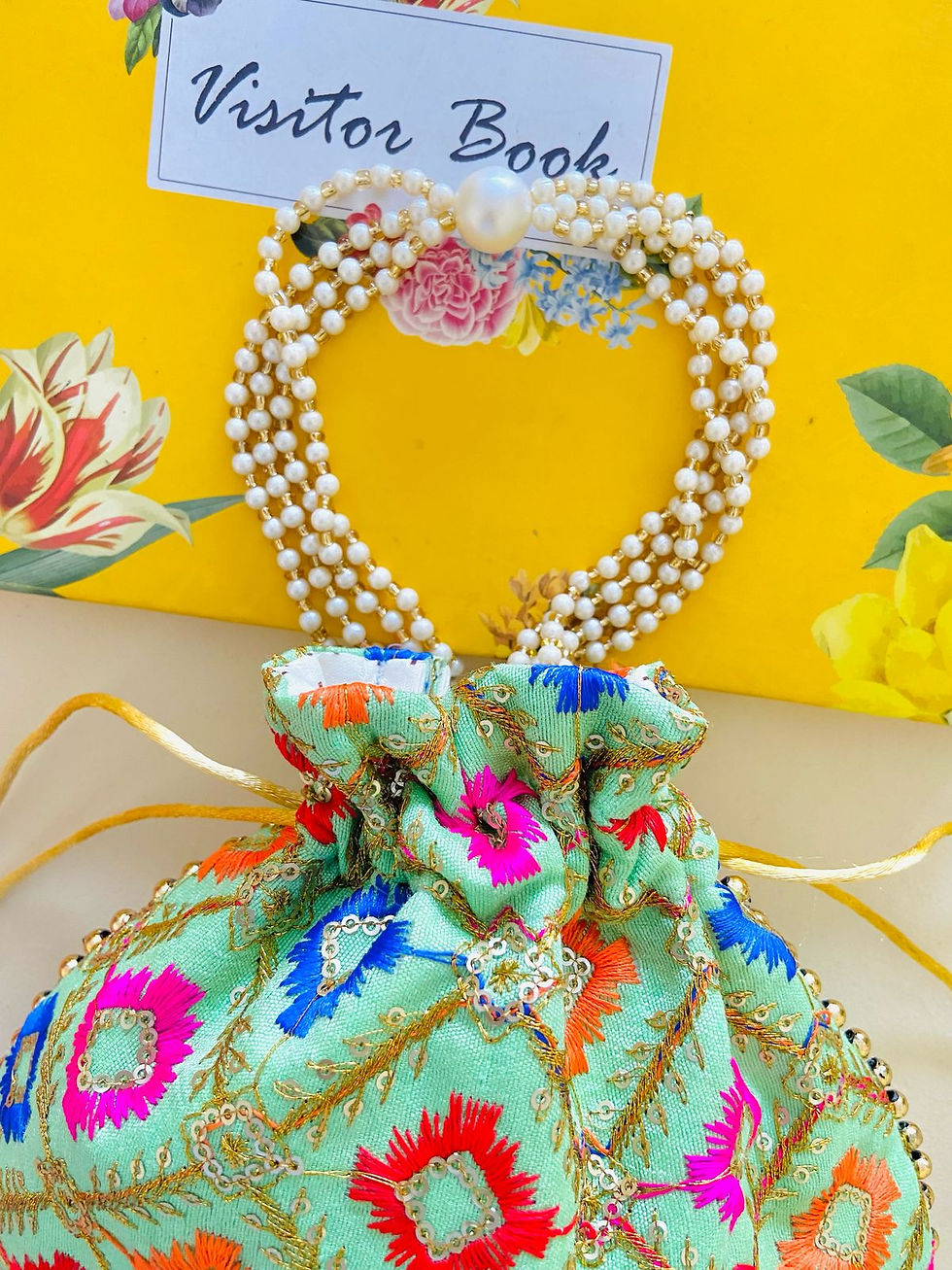 Thumbnail: Women Green Embroidered Designer Potli bag with Pearl Handle and latkan