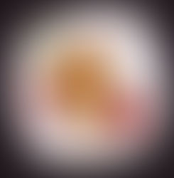 Food stylist photographer Dubai captures crispy spring rolls with chili dip on white plate, styled with red peppers and cilantro on dark background