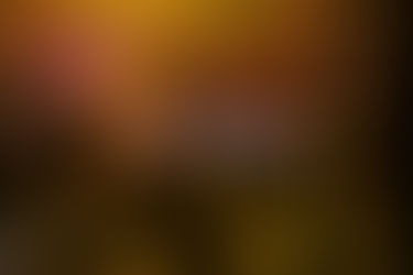 Event Photographer Sharjah capturing a live concert with a full band on stage, vibrant lights, and an excited audience filming the show.