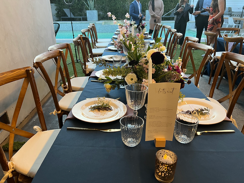 Long outdoor dining table styled by Maison Yen for a catered event