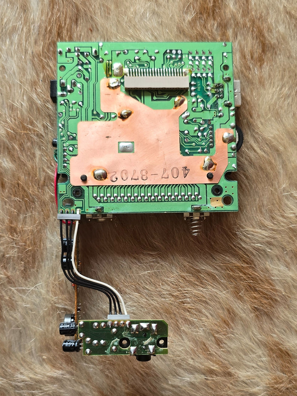 Copper heat-spreader plate on the back of the Game Boy DMG-01 main board