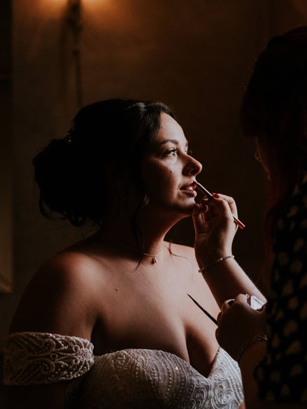 alternative make up artist working on a bride on her wedding day 