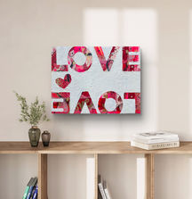 Love Bomb mixed media shown on wall above entry table