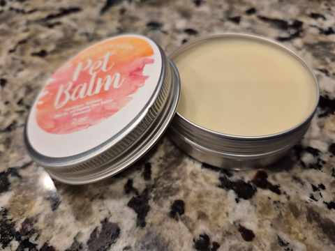 Pet Balm tin, natural lip gloss pet paw balm and pet body butter, close-up shot.
