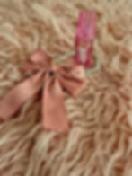 Pink bow and pearl necklace with Lip Gloss Key Chain on pink fur background