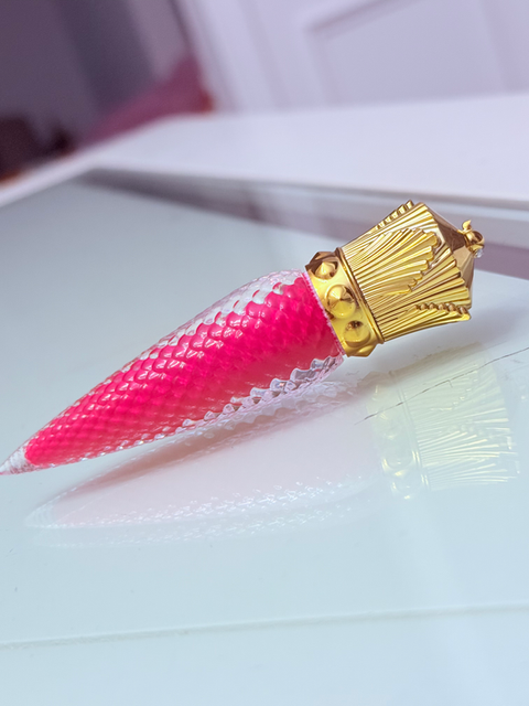 Pink lip gloss with gold top on a white surface for beauty KraftzbyKadin