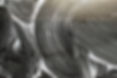 Background, texture of the black surface of a metal car door in white soapy foam after was