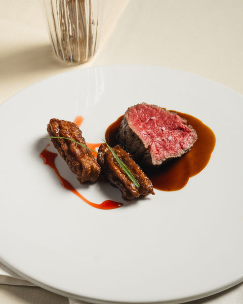 Perfectly plated sliced steak with sauce, luxury fine dining food photography Puerto Rico
