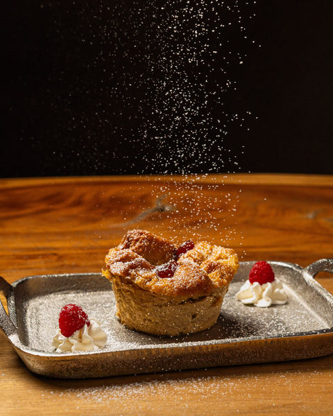 Artisan tart with powdered sugar and raspberry, professional dessert photography Puerto Rico